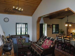 a living room with a couch and a table at Casa de Pereiró in Soajo