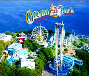 an image of an amusement park with two roller coasters at Holiday Guest House in Hong Kong