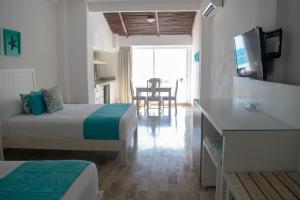 TV a/nebo společenská místnost v ubytování BSEA Cancun Plaza Hotel