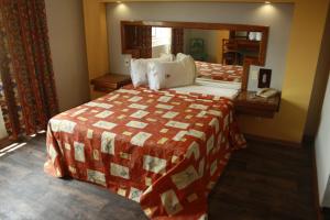 Voodi või voodid majutusasutuse Hotel Mina toas