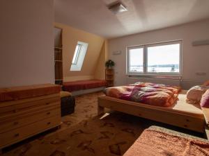 a bedroom with a bed and a window at Guest House Privát Štrba in Štrba