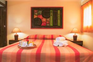 Postel nebo postele na pokoji v ubytování Hotel Las Palmeras + 3 fotografie
