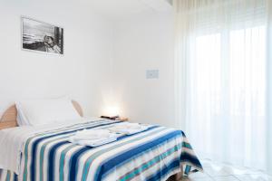 Llit o llits en una habitació de Residence Cigno