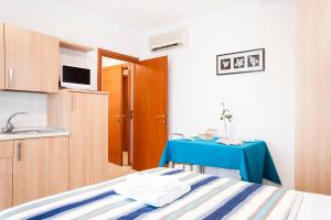 Llit o llits en una habitació de Residence Cigno