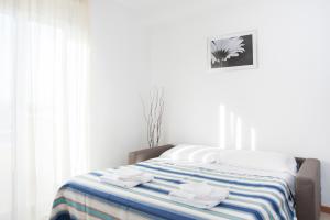 Llit o llits en una habitació de Residence Cigno