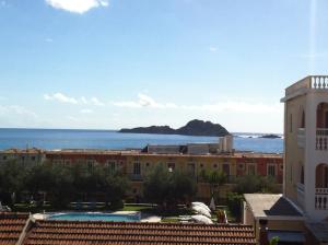 
a large building with a view of the ocean at Eleni Apartments in Arillas
