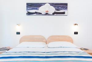 Llit o llits en una habitació de Residence Cigno