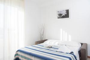 Llit o llits en una habitació de Residence Cigno