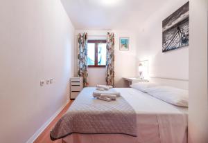 Posteľ alebo postele v izbe v ubytovaní Apartment Andrina + 37 fotografií