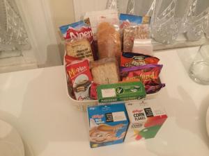 a group of snacks and other food items on a counter at Tower Hill House Basingstoke in Basingstoke