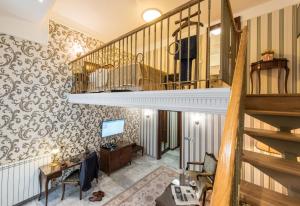 a room with a staircase and a living room at Hotel Moskva in Belgrade