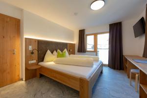 Postel nebo postele na pokoji v ubytování Alpen Apart Heiss - DELUXE XL Apartments