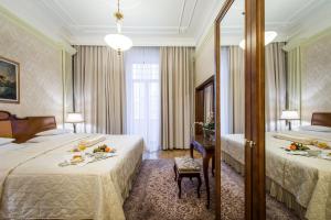 Postel nebo postele na pokoji v ubytování Hotel Moskva