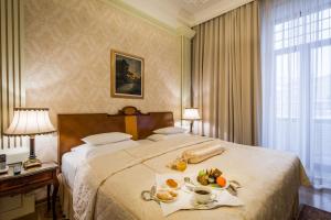 Postel nebo postele na pokoji v ubytování Hotel Moskva