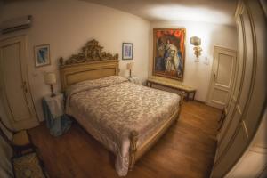 Postel nebo postele na pokoji v ubytování Antica Dimora Conti Custoza