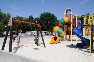 a group of children playing in a playground at Vakantiewoning Zavelbos in Maaseik