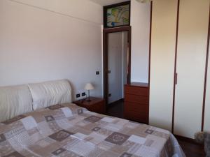 A bed or beds in a room at Checchi House