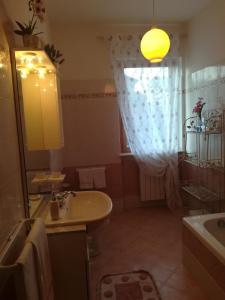 a bathroom with a sink and a mirror at GIARDINO DI PRIMAVERA in Bagnoregio +32 photos