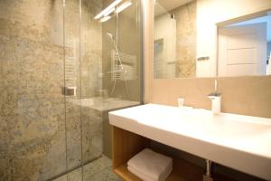 a bathroom with a sink and a shower at ff apartments Jasná Lúčky in Demanovska Dolina