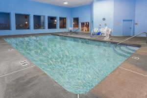 a large swimming pool in a hotel room at Super 8 by Wyndham Corvallis in Corvallis
