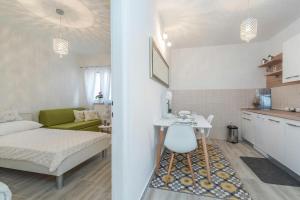 a small apartment with a bed and a kitchen at Apartment Maja in Novalja in Novalja