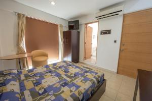 Ένα ή περισσότερα κρεβάτια σε δωμάτιο στο Hotel Oaxaca Inn Express +18 φωτογραφίες