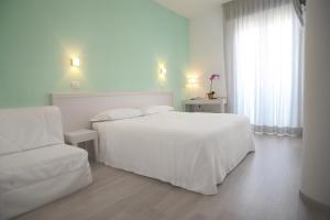 Posteľ alebo postele v izbe v ubytovaní Maree Hotel