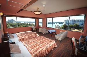 Kashikojima Hotel Bay Garden客房内的一张或多张床位