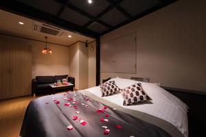 Letto o letti in una camera di Hotel LUNE CLAIRE (Adult Only)