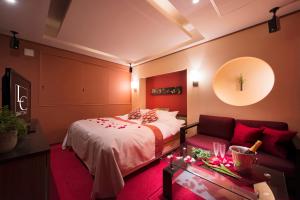 Letto o letti in una camera di Hotel LUNE CLAIRE (Adult Only)