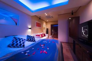 Letto o letti in una camera di Hotel LUNE CLAIRE (Adult Only)