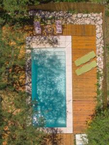 a painting of a swimming pool in a garden at Entre Sierras y Pajaros in Las Rabonas