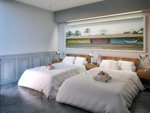 Postel nebo postele na pokoji v ubytování Singular Joy Downtown Residences