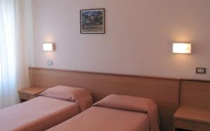 Postel nebo postele na pokoji v ubytování Albergo Moretti