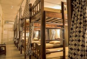 a group of bunk beds in a room at Rumah Larasati in Malang