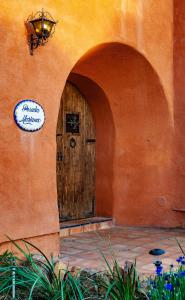 a entrance to a building with a wooden door at Posada Mariana Bed and Breakfast in Catheys Valley
