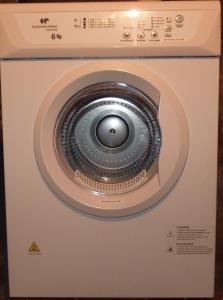 a washing machine with its door open in a room at Résidence Honoré de Balzac in Brest