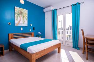 Un pat sau paturi într-o cameră la Hotel Cap Sud