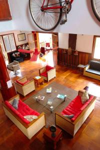 an aerial view of a living room with a bike on the wall at Villa b.Maison d'Hôtes Angkor in Siem Reap