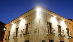 a building with lights on the side of it at Puerta del Sol in Ciudad-Rodrigo