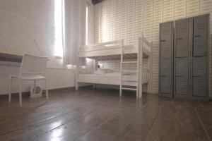 Кровать или кровати в номере CURIOCITY Backpackers Johannesburg