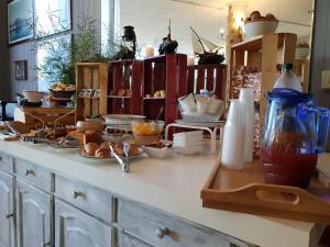 a kitchen counter with a lot of food on it at Hotel Il Casale in Trevignano Romano