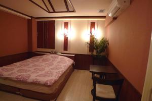 Postel nebo postele na pokoji v ubytování Hotel GOLF Atsugi (Adult Only)