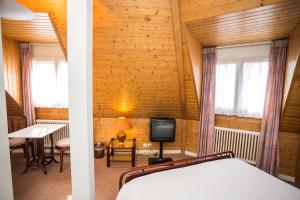 Postel nebo postele na pokoji v ubytování Hôtel Résidence Cité-Verdaine