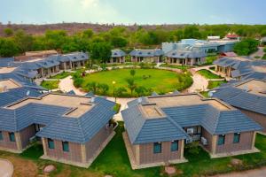 an overhead view of a home with blue roofs at Shri Radha Brij Vasundhara Resort & Spa in Govardhan