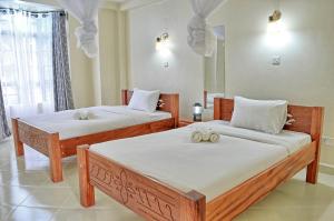 Postel nebo postele na pokoji v ubytování Itibo Resort