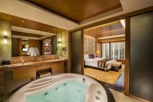 Voodi või voodid majutusasutuse Hotel Okura Macau toas