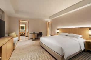 Postel nebo postele na pokoji v ubytování Hyatt Place Chengdu Pebble Walk