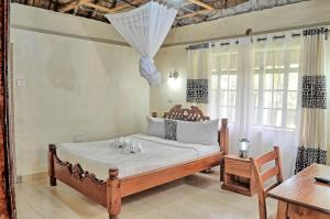 Llit o llits en una habitació de Itibo Resort