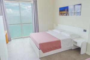 Postel nebo postele na pokoji v ubytování Garda Rooms